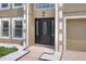 Close-up of a front entrance, features a decorative door, sidelights, and adjacent garage at 5163 Spanish Oaks Dr, Lakeland, FL 33805