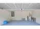 Garage with epoxy floor, water heater, and ample storage space at 5163 Spanish Oaks Dr, Lakeland, FL 33805