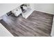 Modern kitchen with hardwood floors, stainless steel appliances, and granite countertops at 5163 Spanish Oaks Dr, Lakeland, FL 33805