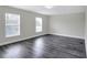 Living Room with hardwood flooring and two windows that bring in ample light at 5163 Spanish Oaks Dr, Lakeland, FL 33805