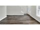 Open-concept living area features modern flooring, neutral walls, and staircase at 5163 Spanish Oaks Dr, Lakeland, FL 33805