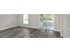 A bright living room leads out to a screened porch at 5163 Spanish Oaks Dr, Lakeland, FL 33805