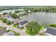 Waterfront neighborhood featuring lake views, mature trees, and well-maintained lawns at 601 Peninsular Dr, Lakeland, FL 33813