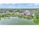 Waterfront homes lining a lake with private docks and lush landscaping at 601 Peninsular Dr, Lakeland, FL 33813