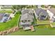 Aerial view of a home with a boat dock, waterfront access and lush green yard at 601 Peninsular Dr, Lakeland, FL 33813