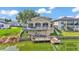 Aerial view of a home, back decks, yard, and waterfront location at 601 Peninsular Dr, Lakeland, FL 33813