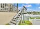 Steps leading to the lake from the back of the house with waterfront views at 601 Peninsular Dr, Lakeland, FL 33813