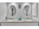 Bathroom featuring double sinks, granite countertops, and plenty of storage at 601 Peninsular Dr, Lakeland, FL 33813
