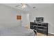 Bedroom features a tv, ceiling fan, closet, and hardwood floors at 601 Peninsular Dr, Lakeland, FL 33813