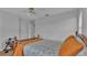 Comfortable bedroom features hardwood floors, a ceiling fan, and two closets at 601 Peninsular Dr, Lakeland, FL 33813