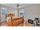 Bright bedroom with hardwood floors, natural light, and a scenic window view at 601 Peninsular Dr, Lakeland, FL 33813