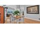 Bright open-concept dining room with hardwood floors and views of the water at 601 Peninsular Dr, Lakeland, FL 33813