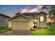 Charming two-story home with a two-car garage and inviting front yard at 601 Peninsular Dr, Lakeland, FL 33813