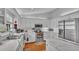 Modern white kitchen with stainless steel appliances and marble countertops at 601 Peninsular Dr, Lakeland, FL 33813