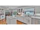 Well-lit kitchen with white cabinets, stainless steel sink, and a marble-top island at 601 Peninsular Dr, Lakeland, FL 33813