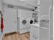 Bright laundry room features a side-by-side washer and dryer, white cabinets, and convenient access at 601 Peninsular Dr, Lakeland, FL 33813