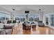 Bright living room with hardwood floors, fan, and view of the water at 601 Peninsular Dr, Lakeland, FL 33813