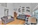 Bright living room with vaulted ceilings, hardwood floors, and lots of natural light at 601 Peninsular Dr, Lakeland, FL 33813