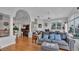 A bright living room with hardwood floors, lots of windows, and a comfortable sofa at 601 Peninsular Dr, Lakeland, FL 33813