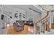 Living room boasts wood floors, a cozy sectional sofa, and a staircase at 601 Peninsular Dr, Lakeland, FL 33813