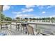Lakeside deck featuring a grill, bar stools, and scenic waterfront views at 601 Peninsular Dr, Lakeland, FL 33813
