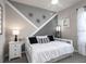 Stylish bedroom with modern decor boasts a comfortable bed and chic design elements at 6060 Barracuda Loop, Wimauma, FL 33598
