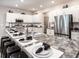 Stylish kitchen with white cabinets, granite countertops, and stainless steel appliances at 6060 Barracuda Loop, Wimauma, FL 33598