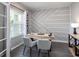 Bright office space features stylish accent wall, light wood desk, and modern decor at 6060 Barracuda Loop, Wimauma, FL 33598