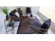 Cozy outdoor patio seating area with wicker furniture and stylish decor, perfect for relaxing or entertaining at 6060 Barracuda Loop, Wimauma, FL 33598