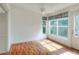 Cozy bedroom with laminate flooring, ceiling fan, and a view of the backyard at 6065 Magpie Dr, Lakeland, FL 33809