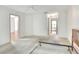 Bedroom with carpet, door to the closet, and a door leading to other rooms at 6065 Magpie Dr, Lakeland, FL 33809