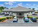 Exterior of the community clubhouse with parking and accessible ramp with professional landscaping at 6065 Magpie Dr, Lakeland, FL 33809