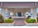 Clubhouse entrance with brick walkway, accessible ramp, and blue handicap parking space at 6065 Magpie Dr, Lakeland, FL 33809