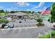 Exterior of the community clubhouse with a parking lot and an American flag at 6065 Magpie Dr, Lakeland, FL 33809