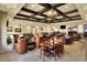 Expansive dining and lounge area with fireplace, coffered ceilings, and varied seating arrangements at 6065 Magpie Dr, Lakeland, FL 33809