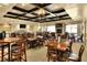 Spacious dining room features coffered ceilings, multiple tables and seating for a large crowd at 6065 Magpie Dr, Lakeland, FL 33809