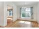Open dining area with natural lighting and laminate floors at 6065 Magpie Dr, Lakeland, FL 33809