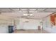 A spacious garage with ample storage shelving and a hot water heater at 6065 Magpie Dr, Lakeland, FL 33809