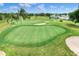 Scenic golf course view featuring manicured greens, sand traps, and picturesque landscaping at 6065 Magpie Dr, Lakeland, FL 33809