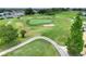 Expansive view of the community golf course with manicured lawns and tree-lined fairways at 6065 Magpie Dr, Lakeland, FL 33809