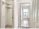 Hallway featuring a large closet, and window view of the front yard at 6065 Magpie Dr, Lakeland, FL 33809