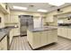 Well-maintained commercial kitchen with stainless steel appliances and center island at 6065 Magpie Dr, Lakeland, FL 33809