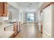 Well-lit kitchen features white appliances and wood cabinets, open to a dining area at 6065 Magpie Dr, Lakeland, FL 33809