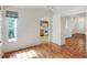 Open-concept living room with laminate floors and views of the kitchen at 6065 Magpie Dr, Lakeland, FL 33809