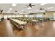 Bright community meeting room with multiple tables and chairs, ideal for gatherings at 6065 Magpie Dr, Lakeland, FL 33809