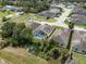 An aerial view of a home with a screened-in pool in a quiet residential neighborhood at 6250 Silver Leaf Ln, Lakeland, FL 33813