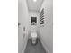Cozy bathroom with toilet, window, and simple decor at 6250 Silver Leaf Ln, Lakeland, FL 33813