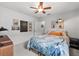 Calm bedroom with a ceiling fan and artistic wall decor at 6250 Silver Leaf Ln, Lakeland, FL 33813
