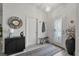 Bright foyer featuring a modern chandelier, stylish decor, and a sleek accent cabinet at 6250 Silver Leaf Ln, Lakeland, FL 33813