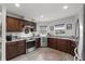 Well lit kitchen featuring granite counters, stainless steel appliances, and modern fixtures at 6250 Silver Leaf Ln, Lakeland, FL 33813
